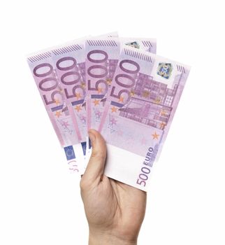 Male hand holding four 500 euro notes isolated