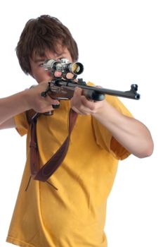 Teenage boy looking through a rifle scope