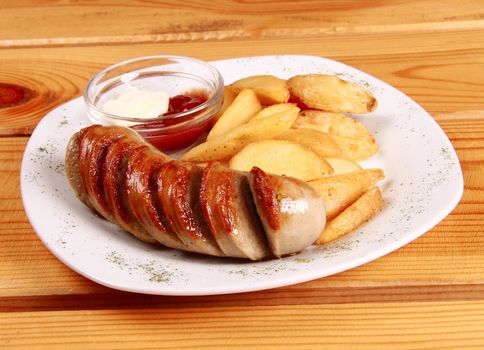 grilled sausages with French fries and ketchup