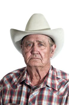 Cowboy with the years of experience written in the lines of his face.