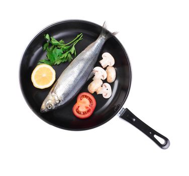 fish in pan with vegetables