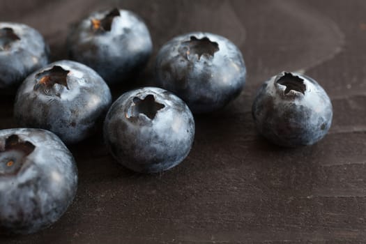 Blueberry on wooden table background