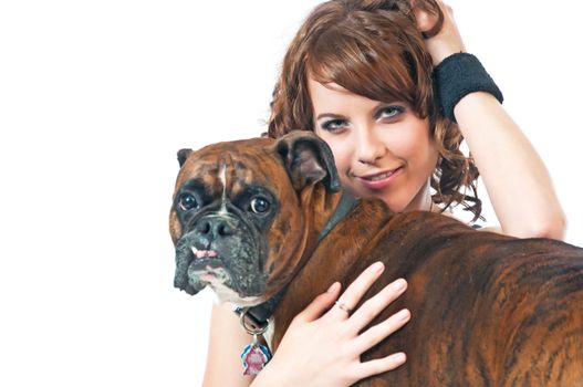 Brunette beauty poses with her pet dog, a pedigreed Boxer.