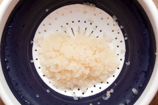 Water kefir grains in strainer