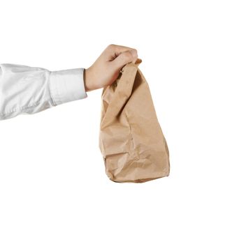 Man holding a brown paper bag in his hand