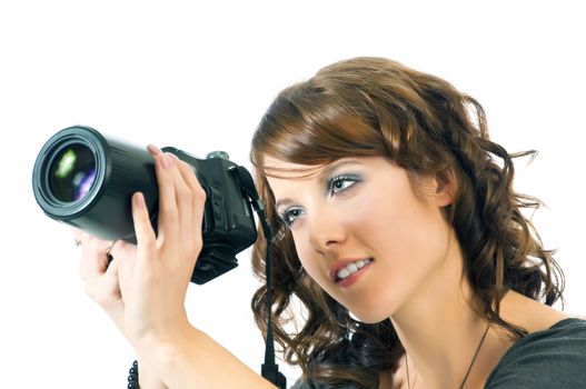 Beautiful young woman checking the lcd screen on the back of her digital camera