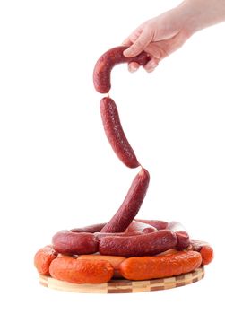 hand holding sausages