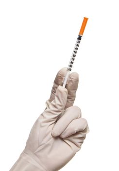 Hand holding syringe isolated on white