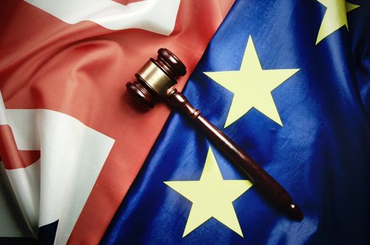 Gavel on top of British and European flags 