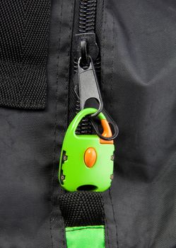 Green lock on a bag's zipper