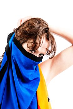 A pretty brunette covers her face with a colorful sc arf.
