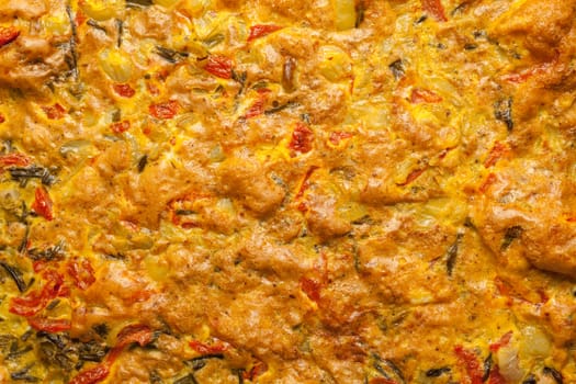 Scrambled eggs with red pepper and green onion