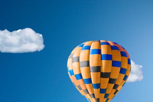 Hot air balloon against brilliant blue sky
