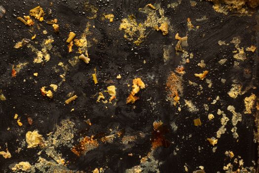 Food left on black oven dish