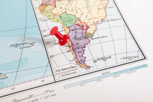 Red push pin showing the location of a destination point on a map. South America