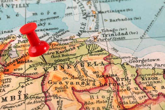 Red push pin showing the location of a destination point on a map. Venezuela