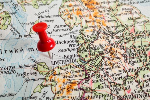 Red push pin showing the location of a destination point on a map. Liverpool