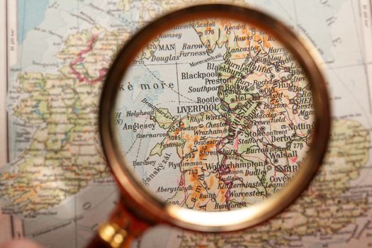 Magnifying glass in front of a Liverpool map