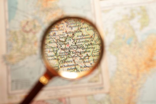 Magnifying glass in front of a Birmingham map