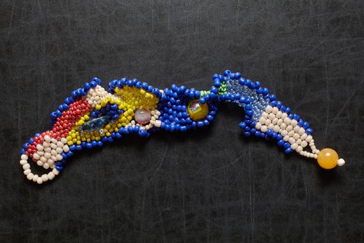 Jewelery from beads on blackboard