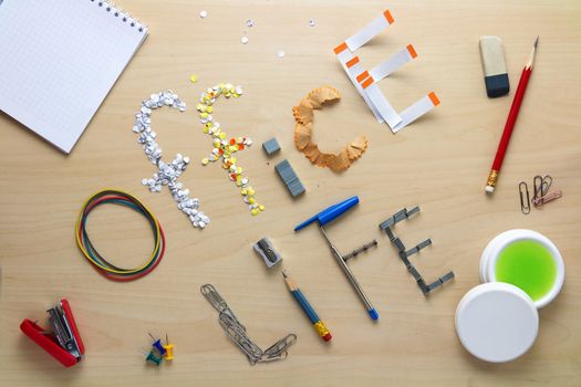 Office life inscription on a wooden desk laid out of stationery. Clerk's weekdays. Daily routine