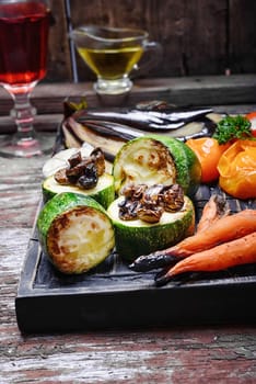 Roasted summer vegetables on the kitchen cutting board