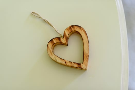 decorative heart made of wood on the table