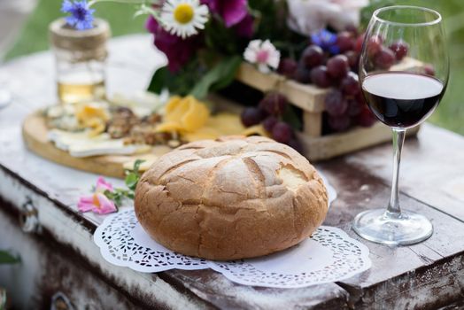 rustic decorative photo zone with suitcases, wine. cheese