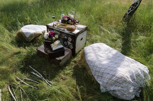 rustic decorative photo zone with suitcases, wine. cheese