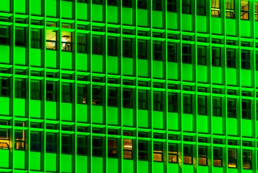 horizontal image of a building with green lights