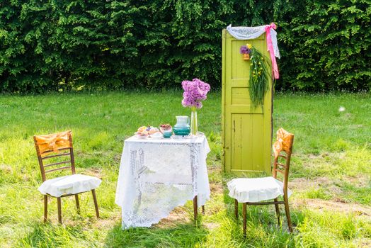 Decorated door table chairs in the garden