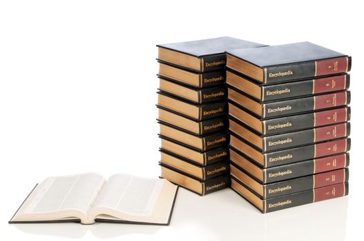 A full set of encyclopedias with one open to a research page.