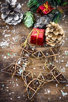Christmas decorations and gifts on a background of pine branches