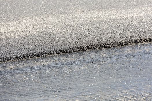 Cross Section of Newly Laid Down Asphalt close up.