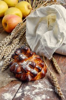 Still life with fresh homemade cakes,flour and ears of wheat