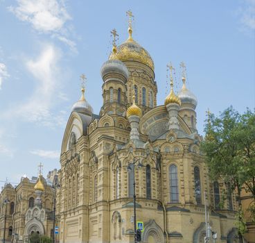 beautiful Christian church in St. Petersburg with golden domes and crosses