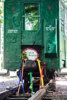 Train sign decorated with flowers just married