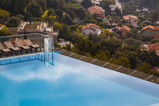 Swimming pool over the hills in french riviera during summer time