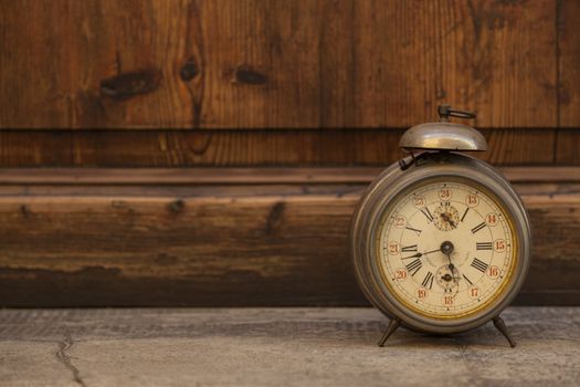 Vintage and old clock on wood background
