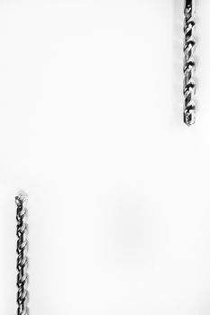 Drill bits of different sizes isolated over white background with copy space