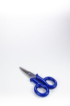Typical electrical used scissors with blue arms
