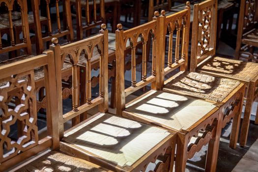Line of wood chairs in a christian curch