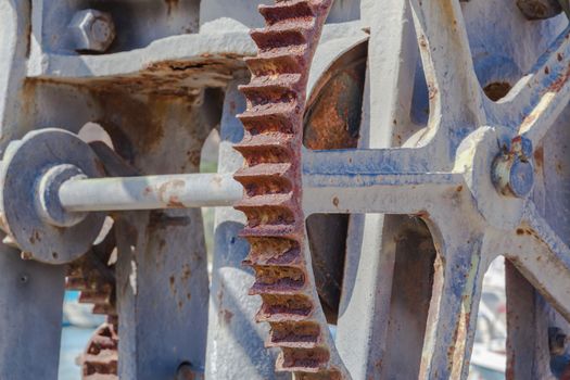 Old rusty weathered sea boats gears on a port
