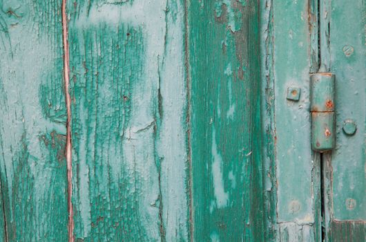 Grunge old wood panels ruined by weather with hinge