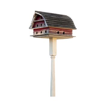 Purple Martin birdhouse made to look like a barn with a Gambrel roof. Isolated on white with a clipping path.