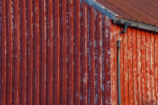 A grunge weathered home with a broken gutter