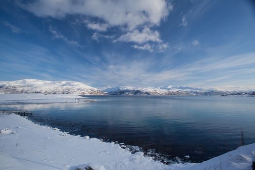 A beach covered by snow in winter time