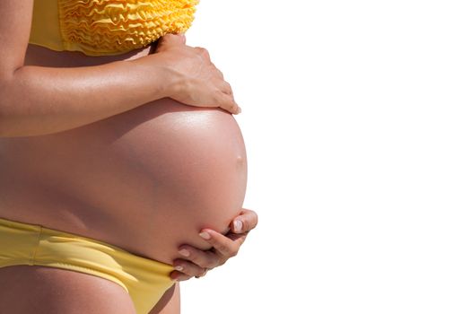 Pregnant woman with hands over tummy at white background