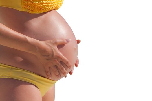 Pregnant woman with hands over tummy at white background