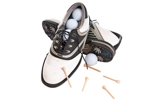 Woman's golf shoes isolated on a white background with golf balls and tees.